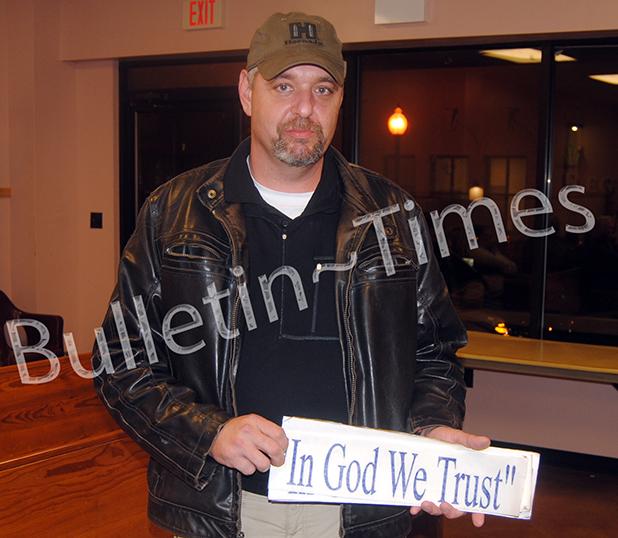 Whiteville Police to add 'In God We Trust' on squad cars Whiteville police chief Steven Stanley shows the Whiteville Board of Mayor and Aldermen the “In God We Trust” decals that will be placed on the rear of all Whiteville police cars.