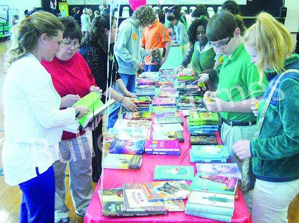 Students line up at BMS to select their own hard back book thanks to a $5,000 grant from best selling author James Patterson during the school’s Book giveaway day on Friday March 4.