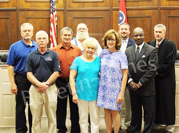 County Officials Take Oath of Office Left to right: New County Commissioner Johnny Weems, re-elected School Board Member Terry King, Appointed School Board Member Gene Ross, new Road Supervisor Matt Knight, re-elected School Board Member Beverly Bodiford, re-elected County Commissioner Connie Young, re-elected Assessor of Property Josh Pulse, re-elected School Board Member Jerry Crisp, and Judge Cary.