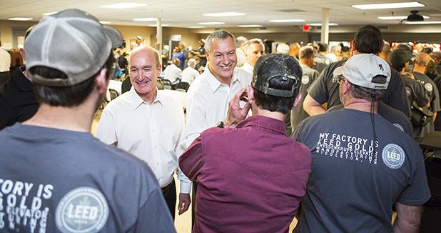 ThyssenKrupp Elevator receives sustainability award Rich Hussey, left, President and CEO of ThyssenKrupp Elevator Americas, and Andreas Schierenbeck, global ThyssenKrupp Elevator CEO, congratulate employees at the celebration of LEED Gold Certification at the Middleton, Tennessee factory.