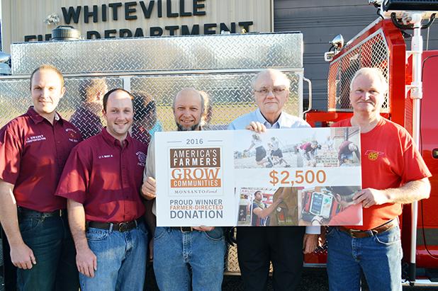 Photo left to right: John Swarey, Jr. Swarey, Samuel Swarey, Mayor James Bellar, Fire Chief Ernie Burkeen.