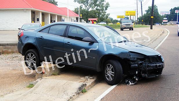 No injuries in Saturday morning crash The driver of this 2006 Pontiac G6 was not injured, after sideswiping another car and coming to rest over this small retaining wall.
