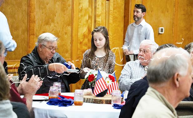 Compassion Week Honors Vietnam Vets Presly Smith serves lunch to Vietnam Vets. Many students on Spring Break helped serve and bus tables. Photo by Ginger Tester.