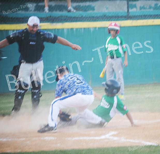 Four Bolivar Dizzy Dean teams are West Tennessee State Champions Cuaron Price scores for the Bolivar 10U All-Stars during their game against Germantown on Friday, July 10.
