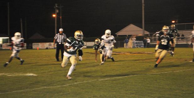 BCHS Tiger C.J. Williams runs for yardage in the game against Harding.