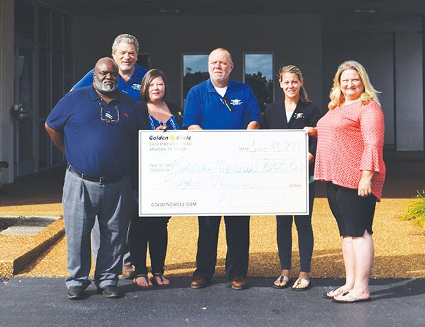 Bolivar Ford Donates $8,000 to Middleton High School Presenting the check (l-r) are Golden Circle Bolivar Ford General Manager, Paul Mann, Michael Cahan, Crystal Brown, Jerry Melton, Jasmine Griffin and receiving the check, Middleton High School Principal Darlene Cardwell.