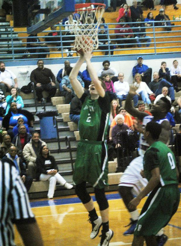 Coach Rudesill gets 700th win David Terburgh goes up for two points.