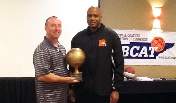 Tim Allen, left, a member of the BCAT committee presents Middleton Coach James Burkley the 2015 BCAT Single A Girls Coach of the Year Award.