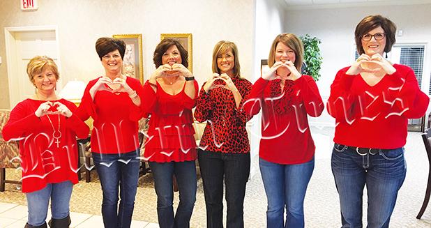 The ladies of Centennial Bank wore red on Friday, February 7 in observance of Go Red Day, a day designed to bring awareness of heart disease and stroke. 