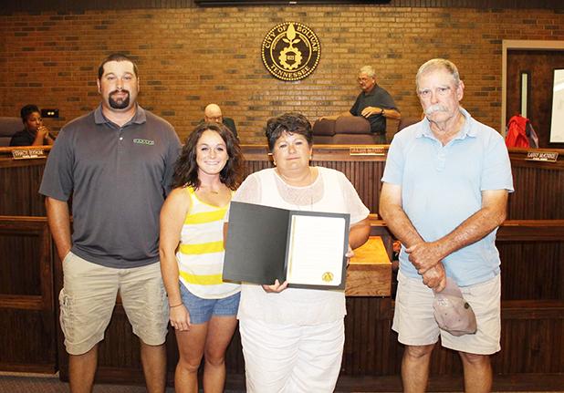 Rhea honored by City of Bolivar Bolivar City Mayor Barrett Stevens honored the late Councilman David Rhea with a memorial proclamation during the July Bolivar City Council meeting. The proclamation was read in front of the council and those in attendance and then a copy was presented to Rhea’s wife, Suzanne, and family members.