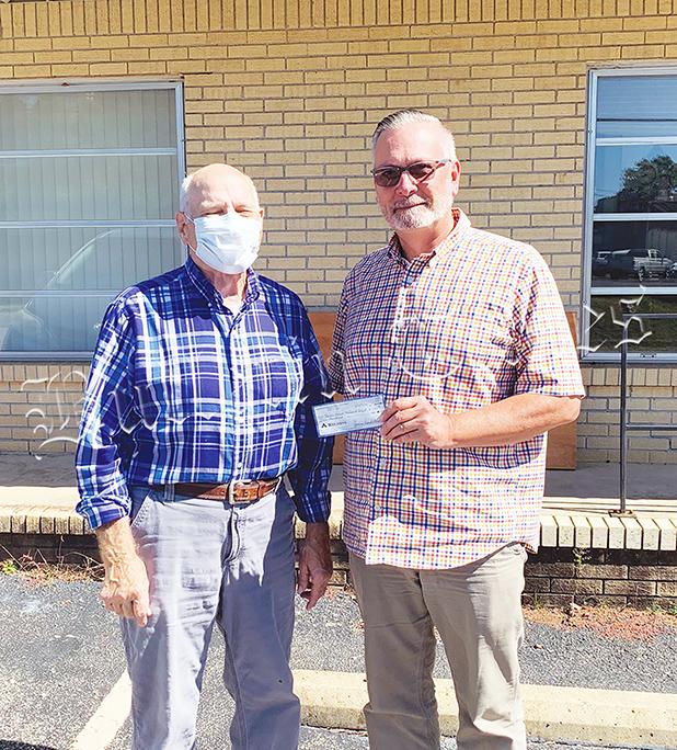 Civitan Donates to Nehemiah Project Photo left to right: James Burchfield of Bolivar Civitan and Nehemiah Project Board of Directors President Johnny Weems.