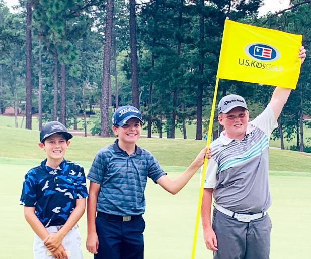 Daniel Competes in World Championship Daniel, far left, poses with the flagstick and his fellow competitors at Talamore.