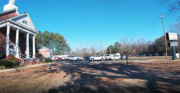 Trucks, trailers and vans lined up in the front parking lot at First Baptist Church in Middleton to receive bulk amounts of boxes for delivery throughout Hardeman County.