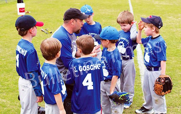 Photo: Casey Swift of Hooper Sawmill talks with his players before the first game of the season. 