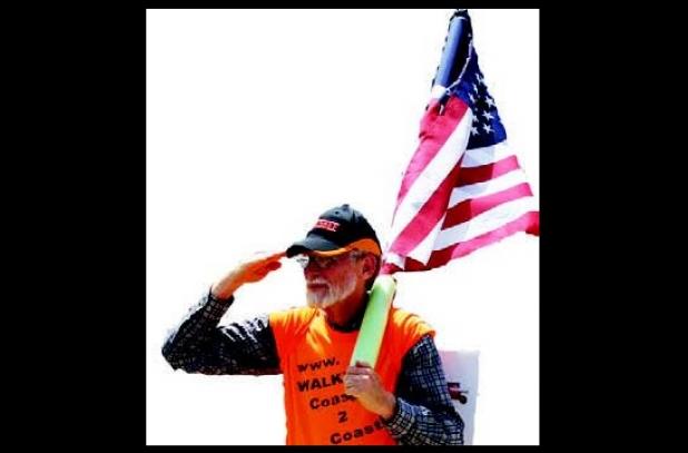 Pastor and Vietnam Veteran Walter McGill is walking from North Carolina to California on a mission. While carrying the American fl ag and saluting motorists, McGill said he is bringing awareness to the 10 Commandments, the love of Jesus, and unity among Christians.