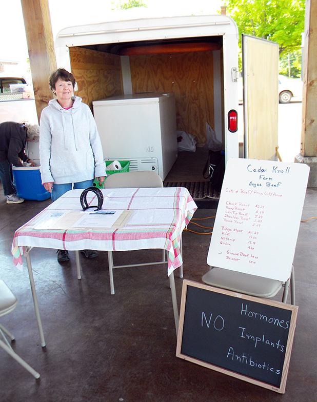 What did your beef have for dinner? Lynda Jacobs stands in front of the covered trailer that houses a deep freeze full of organic beef