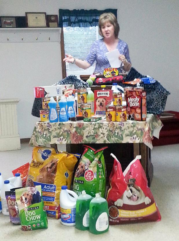 Charla Cooper, President of Hardeman Adoptable Animals was the speaker at the Ruritan Club’s May Meeting. She gave the club members information on the HAA shelter, its operation, and needs. Cooper is pictured here with donations from club members. 
