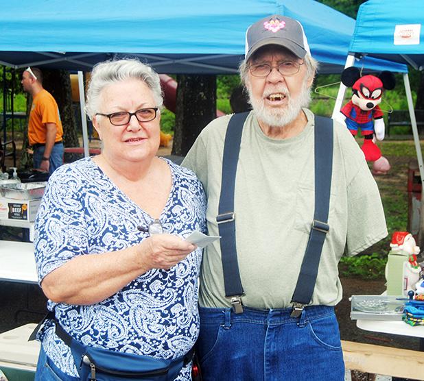 Pictured Bonnie Callahan, representing the Middleton Civitan Club presents a check to Bud Harris to help with his medical bills.