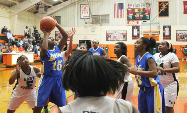 Lady Lions Head to Finals of Middle School Tournament Whiteville’s Jacuqualene Harris takes the winning shot with six seconds in the game, to capture the Whiteville upset victory over Bolivar.