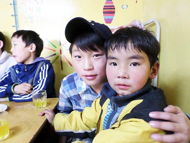 ‘Go ye therefore…to Mongolia’ Two young boys from the Hope Center, located at the city dump, pose for a photo while enjoying some of the services and ministries provided by Harbor Evangelism.