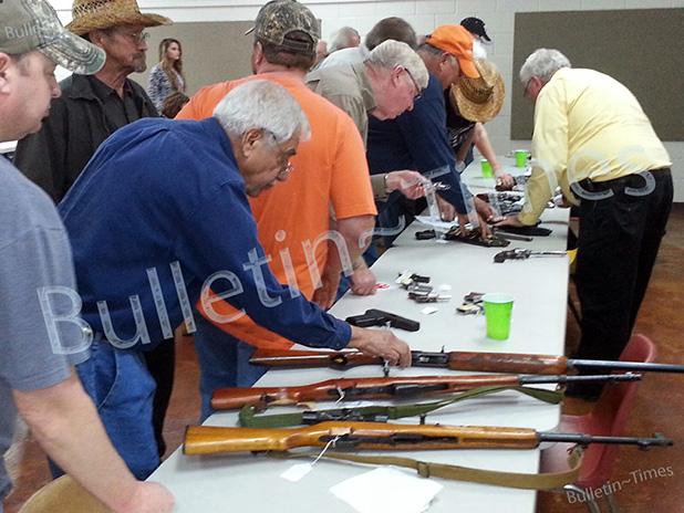 City of Middleton holds gun auction Registered bidders examine a variety of guns prior to the start of the City of Middleton’s auction of surplus and confiscated weapons. The auction was held after previous advertisements of sale failed to produce results. Thirty-five guns were offered at the auction held on Friday, November 6.