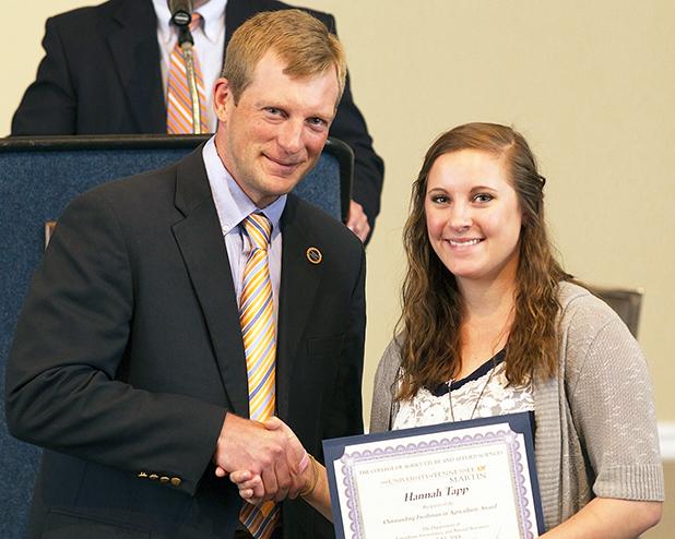 MARTIN – Hannah Tapp (right), of Whiteville, received the Outstanding Freshman in Agriculture Award at a banquet for the University of Tennessee at Martin College of Agriculture and Applied Sciences. She is pictured with Dr. Jason Roberts, assistant professor of animal science.