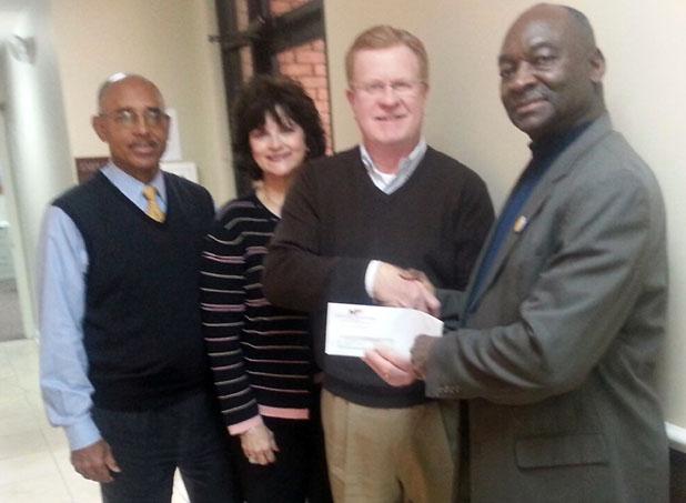 Just imagine……. Former County Mayor Willie Spencer, Imagination Library liaison Cathy Ledbetter, Merchants and Planters Bank President Tommy Sain, and Imagination Library Vice President Monroe Woods (l-r) are pictured at presentation of the Bank’s tenth annual donation to the Library.