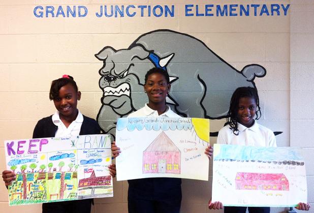 Pictured (l-r): “Keeping Grand Junction Grand” litter campaign winners from GJES, holding their posters, are Breasha Graham, Miracle Lewis and Passion Lewis.