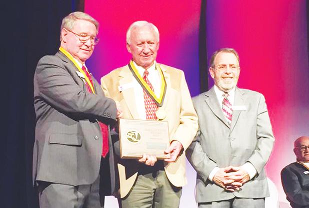 Williams Inducted into TSSAA Hall of Fame Photo: Williams (center) coached Bolivar Central to two state championships.