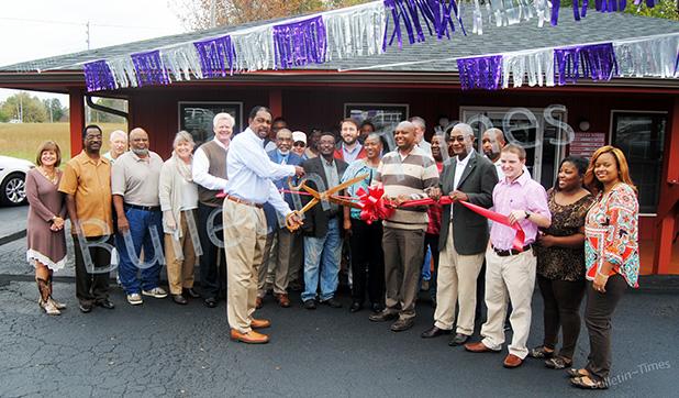Moody’s Auto Sales holds ribbon cutting Friends, family and local officials look on as Gwen Moody cuts the ribbon on the third location of Moody’s Auto Sales.