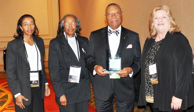Pictured is Mr. Robertson, his wife, his daughter and Mary Heinzen. 