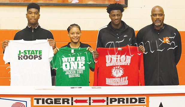 Middleton High School celebrated three signees on April 17 as (left to right) Kelan Jones and Sequoia Warren signed with Jackson State and Tylandrius Parks signed with Union University. They are pictured with Middleton Head Basketball Coach James Burkley.