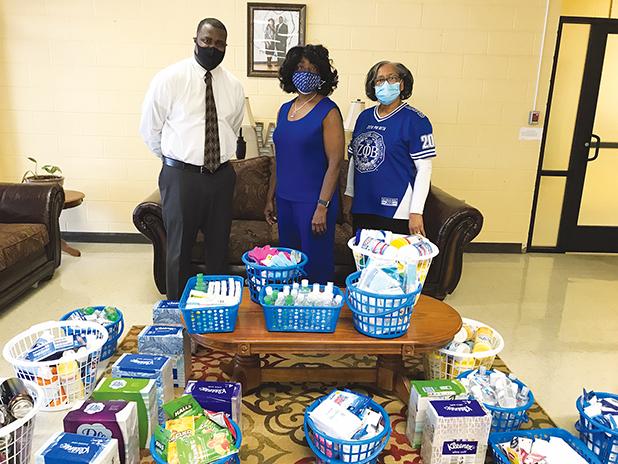 The Zeta Phi Beta Sorority donated over $500 of hand sanitizer, disinfectant spray, sanitizing wipes and other supplies to help with Covid-19 protocols. Dr. Yvonne Allen and member Dixie Spencer delivered the supplies on Tuesday, February 4 to Principal Cedric Crisp on behalf of Zeta Phi Beta Sorority.