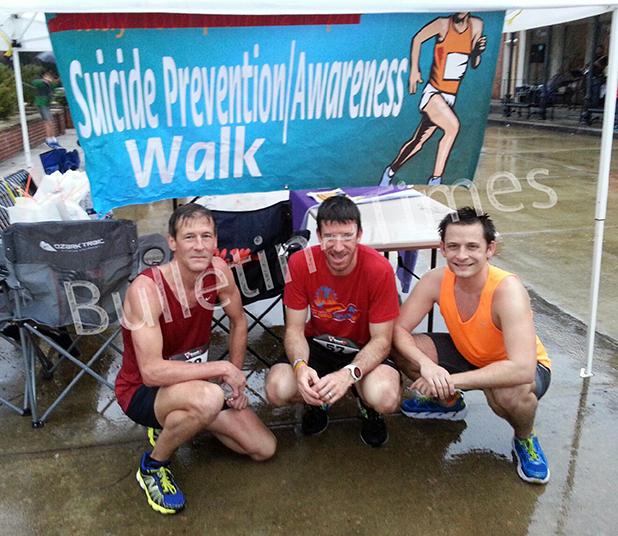 Rain couldn’t put a damper on Suicide Prevention/Awareness Walk Leading the group of 83 runners, joggers, and walkers were (l-r): Shane Fawcett, first place; Kyle Prince, second; and Klyne Fawcett, third.