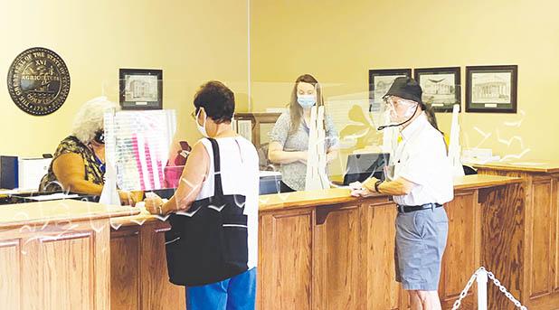 Early Voting in Hardeman Co. Early voters on July 17 prepare to vote.