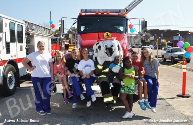 BFD holds annual Fire Prevention Festival Firepup posed with HES cheerleaders Kenley Mitchell, Gracie Swift, Chesney Cuthberth and Brianna Gooch, Michael Rivers, Jemeria Rivers, Marnina Smeltser and HES cheerleader Summer Williams.