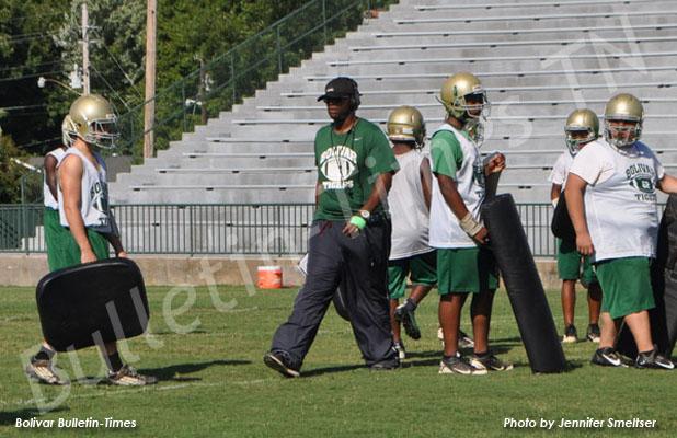 Coach Woodrow Lowe, Jr. coaches his players in a traditional manner, which is hard with conservative play.