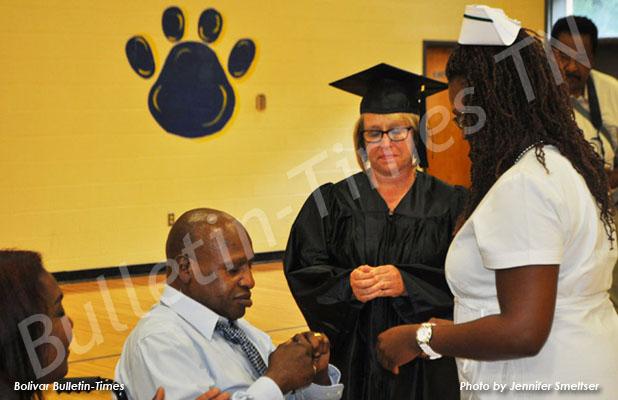 TCAT Whiteville celebrates summer graduates Michelle Sutton is pinned by her father, Dr. Herbert L. Sutton, MD.