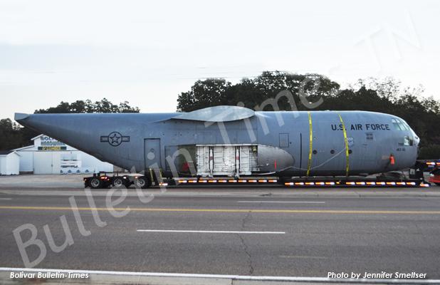 The Lockhead Martin C-130 E model airplane carried through Bolivar by truck driver Kevin Kincaid rested overnight in the Bolivar Hardware and Lumber parking lot. Kincaid left Little Rock Air Force Base on Thursday heading to New York. 