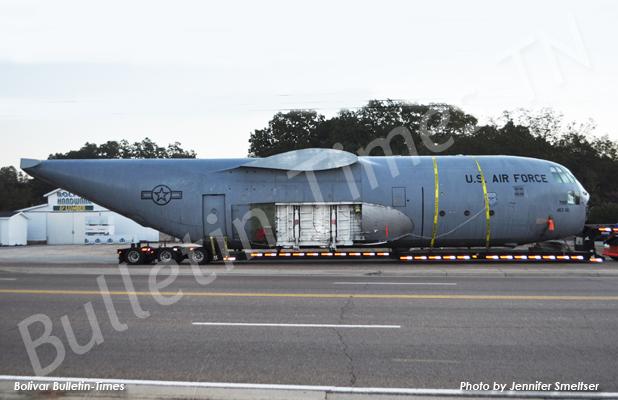 Truck load on Highway 64 draws interest The Lockhead Martin C-130 E model airplane carried through Bolivar by truck driver Kevin Kincaid rested overnight in the Bolivar Hardware and Lumber parking lot. Kincaid left Little Rock Air Force Base on Thursday heading to New York.