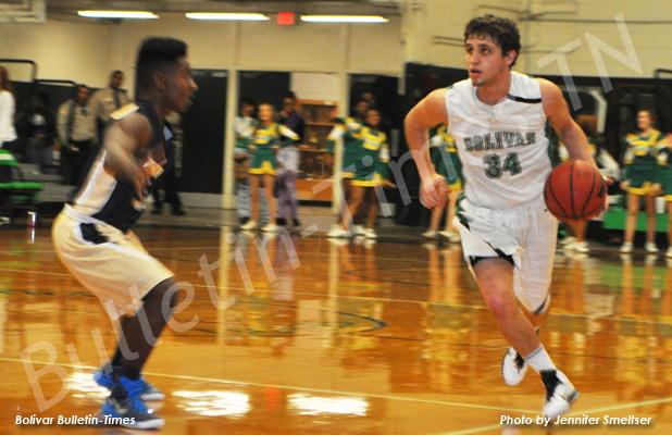 BCHS wins one and loses one BCHS Tiger Kaleb McKinnie takes the ball down the court against Arlington.
