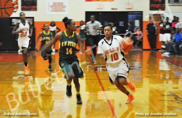 MHS basketball closes a tough week with growth MHS Lady Tiger Sequoya Warren takes the ball down the court for the point against H.W. Byers.