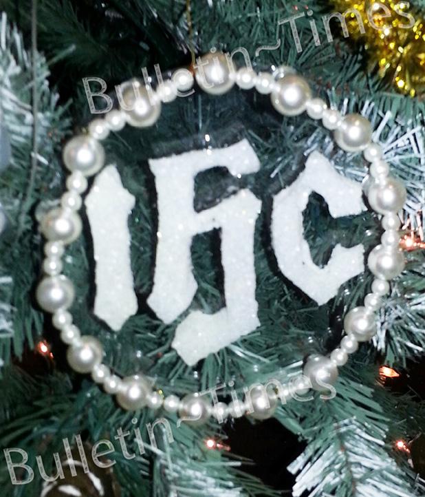 Chrismons are a type of tree decoration. They represent a variety of Biblical and Theological concepts well known by believers. This Chrismon contains the letters Iota, Eta, and Sigma in a circle. These are the first three letters in the Greek word for Jesus. The circle symbolizes eternity. The message here is Jesus gives us eternal life. 