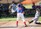 John Baker slides into home for the first run of the game on July 22 against Jackson County National. 