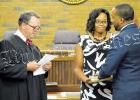 Bolivar Mayor McTizic takes the oath of office from Hardeman County General Sessions Judge Boyette Denton as wife Demetria looks on. Photo by Hannah Pattat.