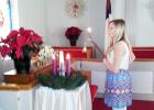 Ruthie Harstin lit the Advent candles at the Middleton United Methodist Church Chrismon Tree service. 