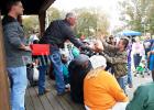 Middleton Pentecostal Tabernacle gives back Pastor Tim Wilbanks hands out one of the 80 turkeys Middleton Pentecostal Tabernacle Church gave to their Block Party attendees on Halloween day.