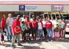 BBQ Store hosts ribbon cutting in Whiteville Roosevelt Bowers, undoubtedly operating on a few short hours of sleep after a long night of cooking, cuts the ribbon for the BBQ Store in Whiteville.