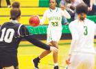 Both Bolivar Central Basketball teams reached the semifinals of the District 15AA tournament with wins on Monday and Tuesday.  Bolivar is hosting the district tournament for the first time since 2003. For more Sports, see A12-13. Photo of Nakidra Champion by Heather Pulse. 