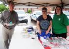 Doug Maxwell stops by the FUMC bake sale to pick up a couple of pies from Michelle Burrell and Rachel Howell.